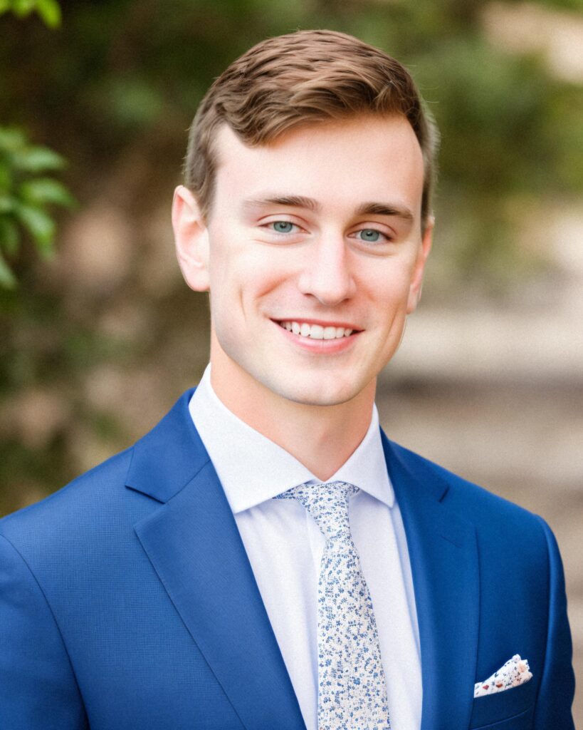 professional headshot wearing blue suit