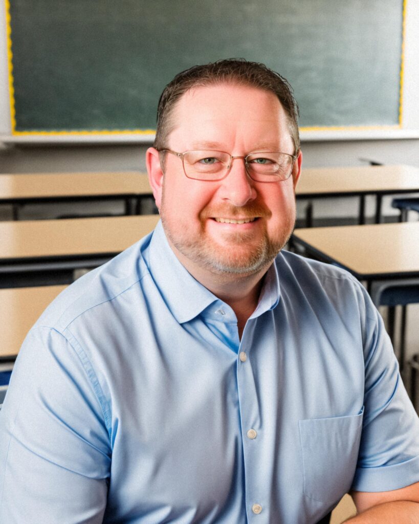 teacher with glasses headshot